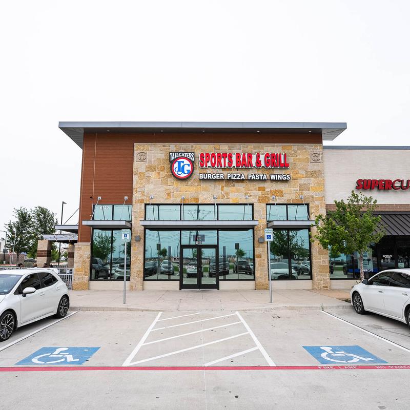The restaurant's building and the parking lot in front.